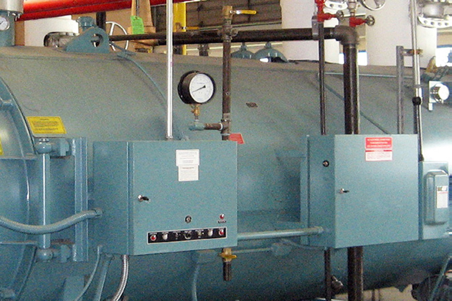 Side view of a boiler and the control panel