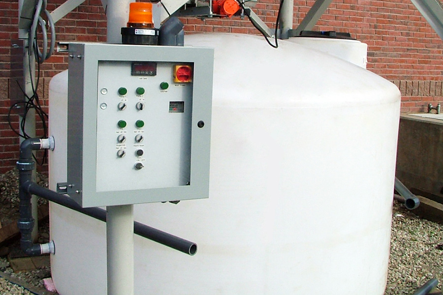 Lower tank of ash silo with control panel