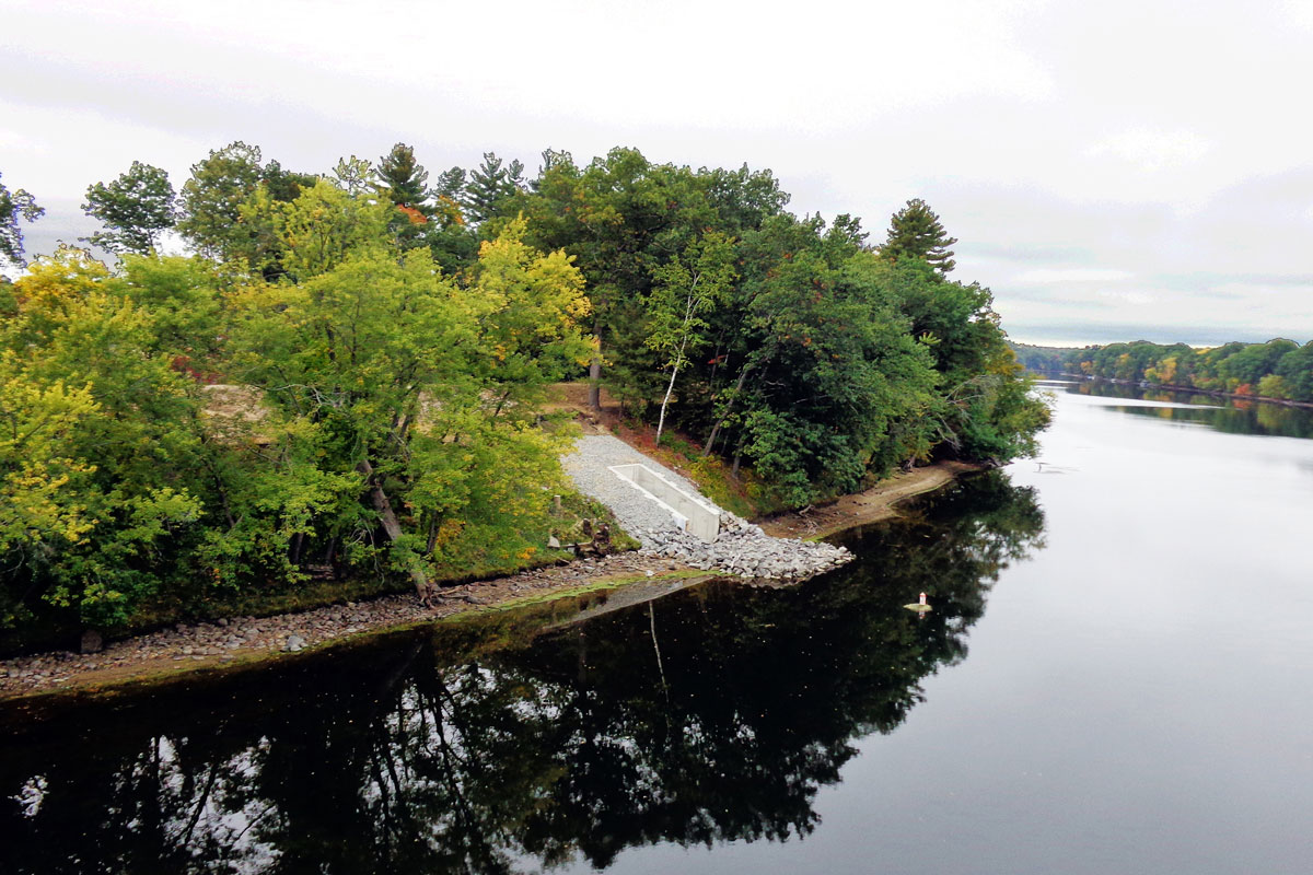 Completed discharge pipe headwall that releases purified overflow into the Merrimack River