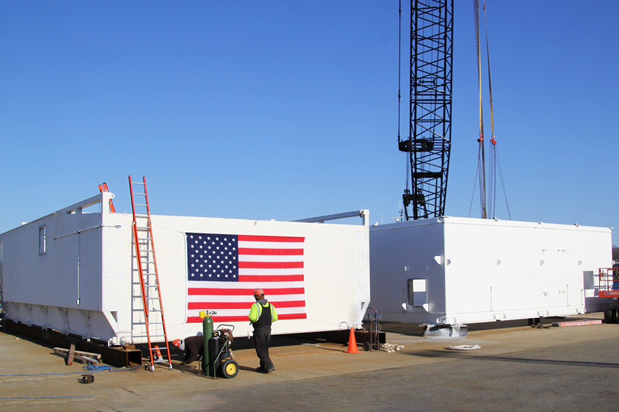 Finalizing the modular unit on the Portsmouth, NH city dock before transport to the shipyard