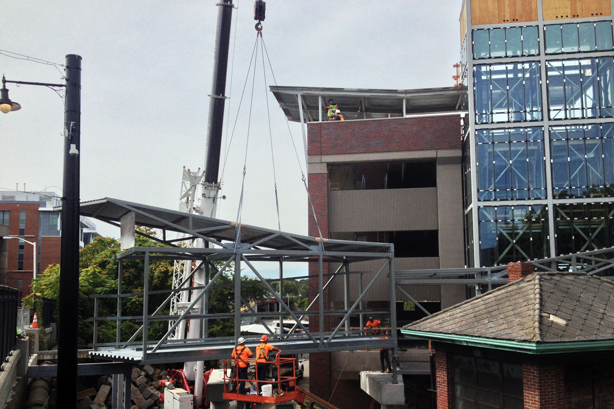 Moving the pedestrian bridge into position, this required precision work by all involved