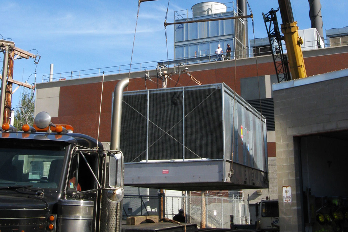 Careful rigging was required to lift the 11 ton roof-top cooling tower