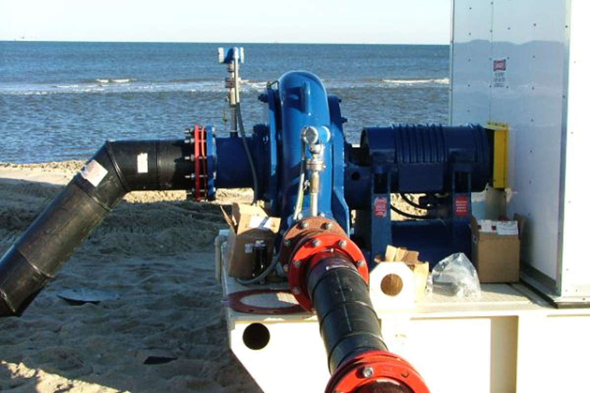 A pump connected and ready to operate on the beach