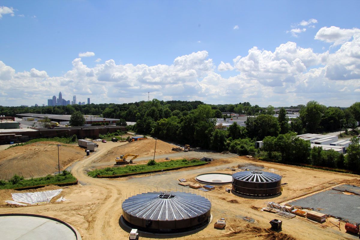 Progress photo of two of the tank builds with the City of Charlotte in the background