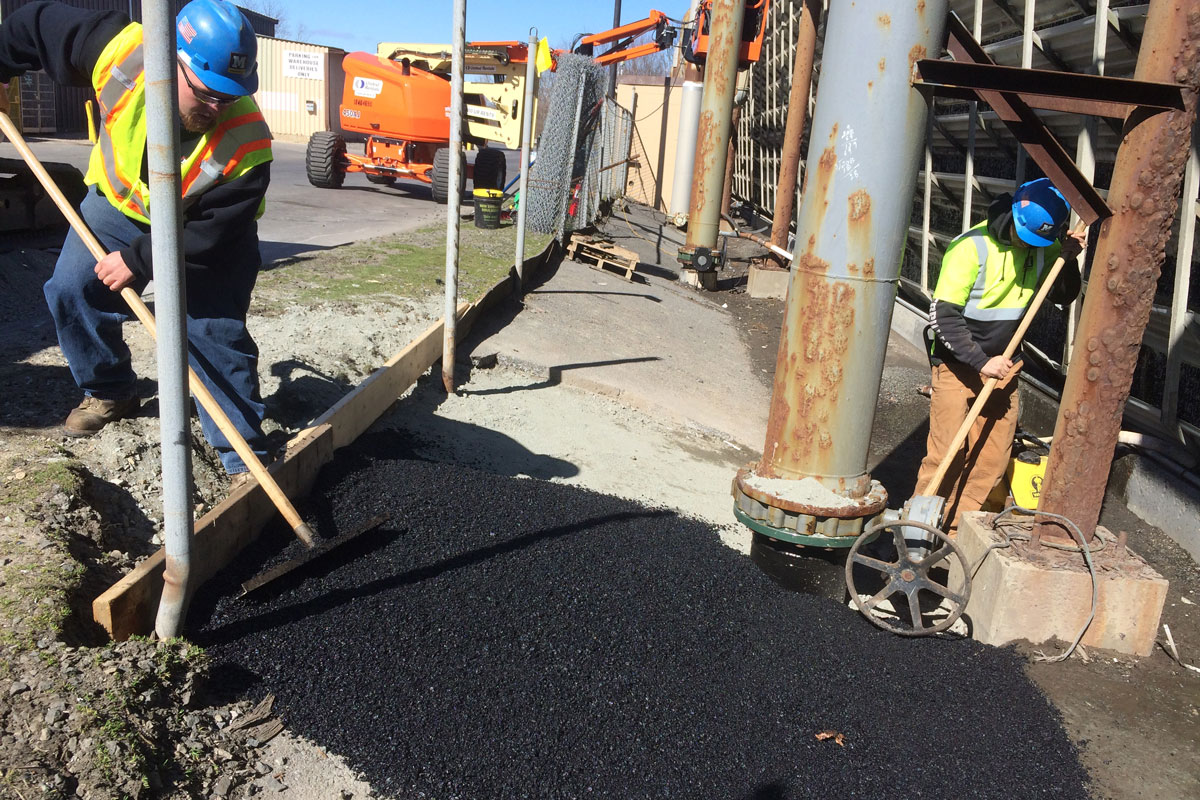 Repaving the coolant line work area with the repaired coolant line in place