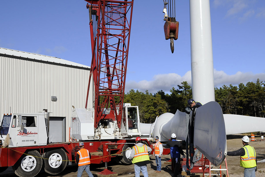 Getting the huge blades into position for installation on turbine